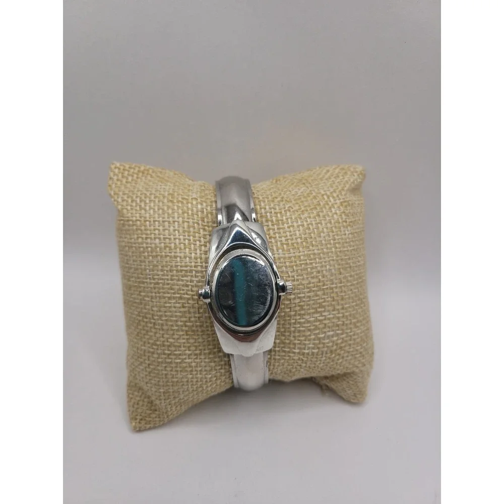 Xanadu Women's Silver Tone Hinged Cuff Bangle Quartz Watch Oval Dial Reverse